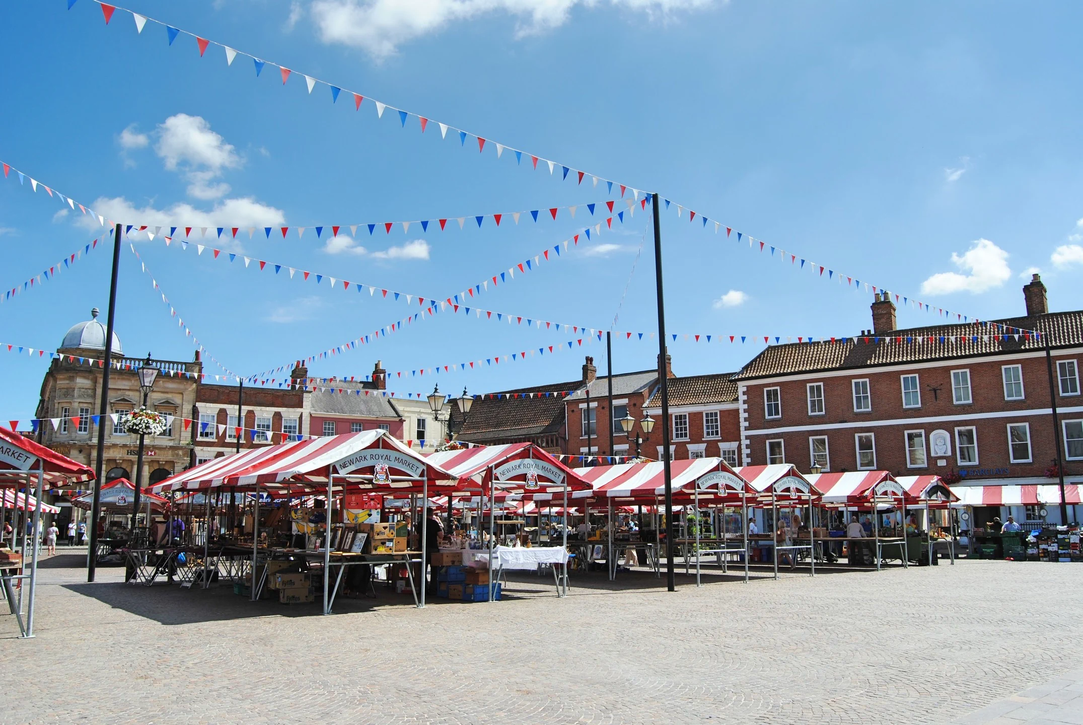 Newark market square with traditional stalls showcasing tourism attractions and supporting local economic growth in Newark