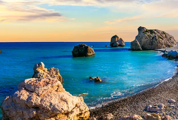 Rocky Cyprus coastline with turquoise sea and beach highlighting ownership framework for overseas property investors