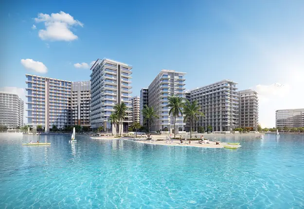 Modern Dubai waterfront apartments with lagoon and palm trees highlighting strong rental demand and overseas property investment appeal