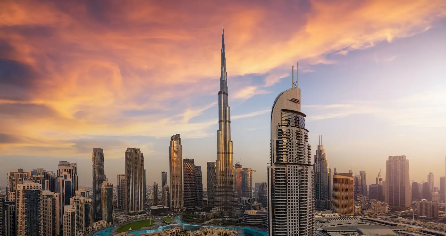 Dubai skyline with Burj Khalifa at sunset highlighting premium property investment opportunities in a global real estate market
