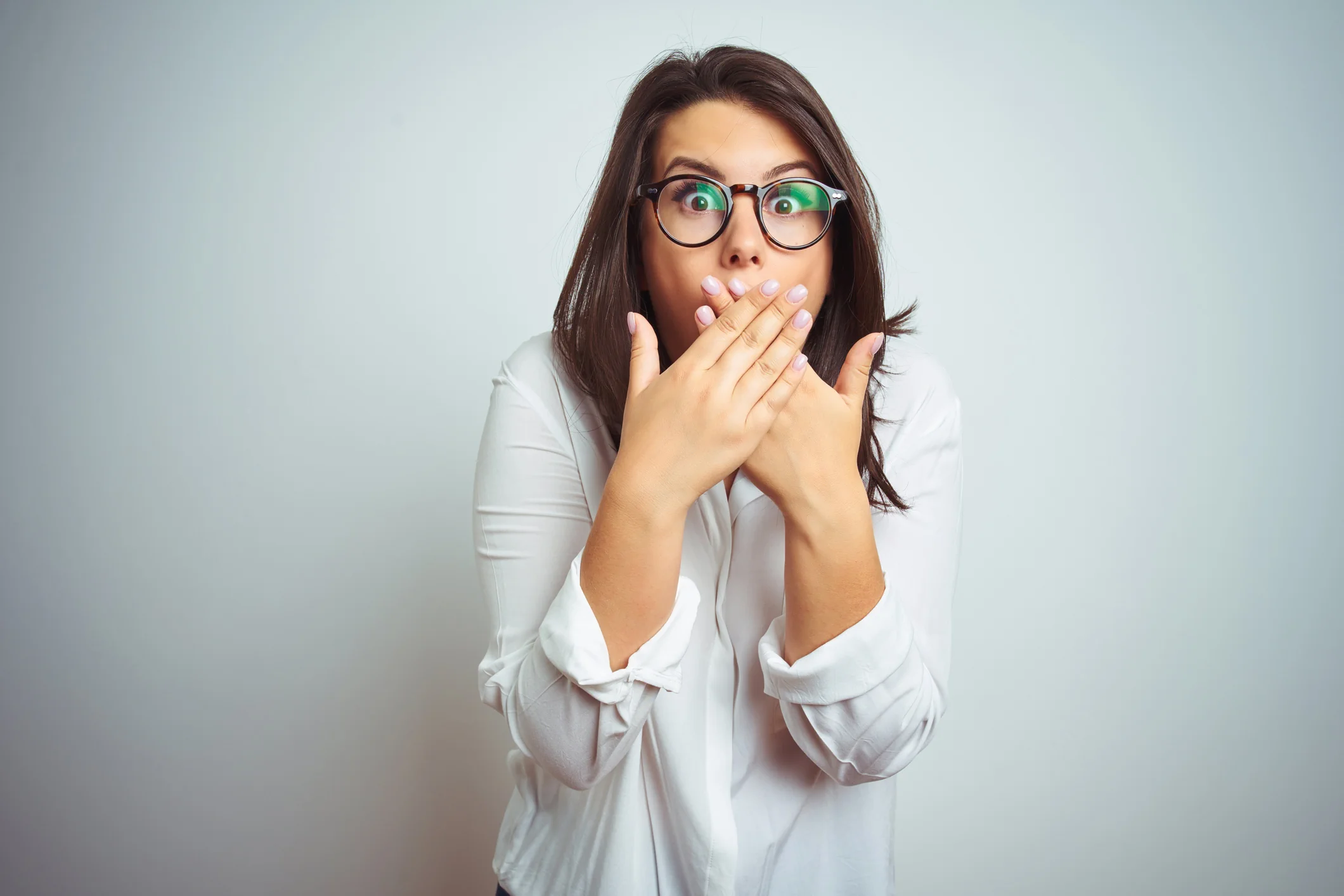 Surprised woman reacting to unexpected costs and common mistakes linked to UK property investment decisions and risks