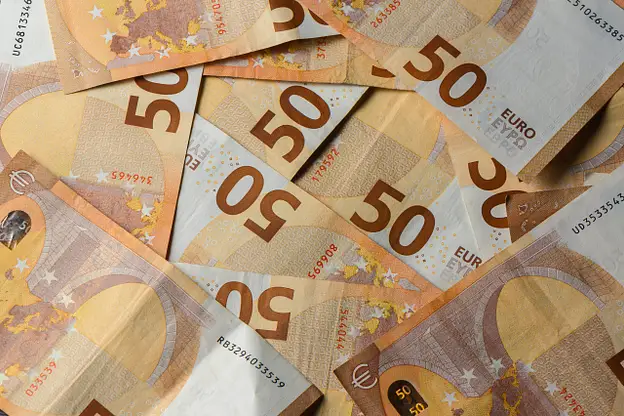 Euro banknotes scattered representing financial considerations for Cyprus property investment and overseas market risks