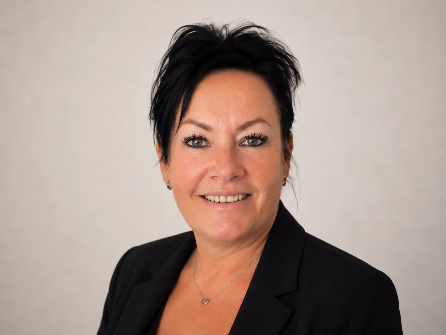 Professional woman in business attire smiling representing Fran Cox CFO property investment financial leadership and strategy