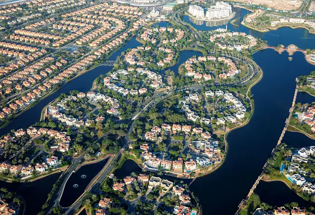 Aerial view of Dubai residential communities with villas and waterways highlighting rental demand and diverse property investment use cases