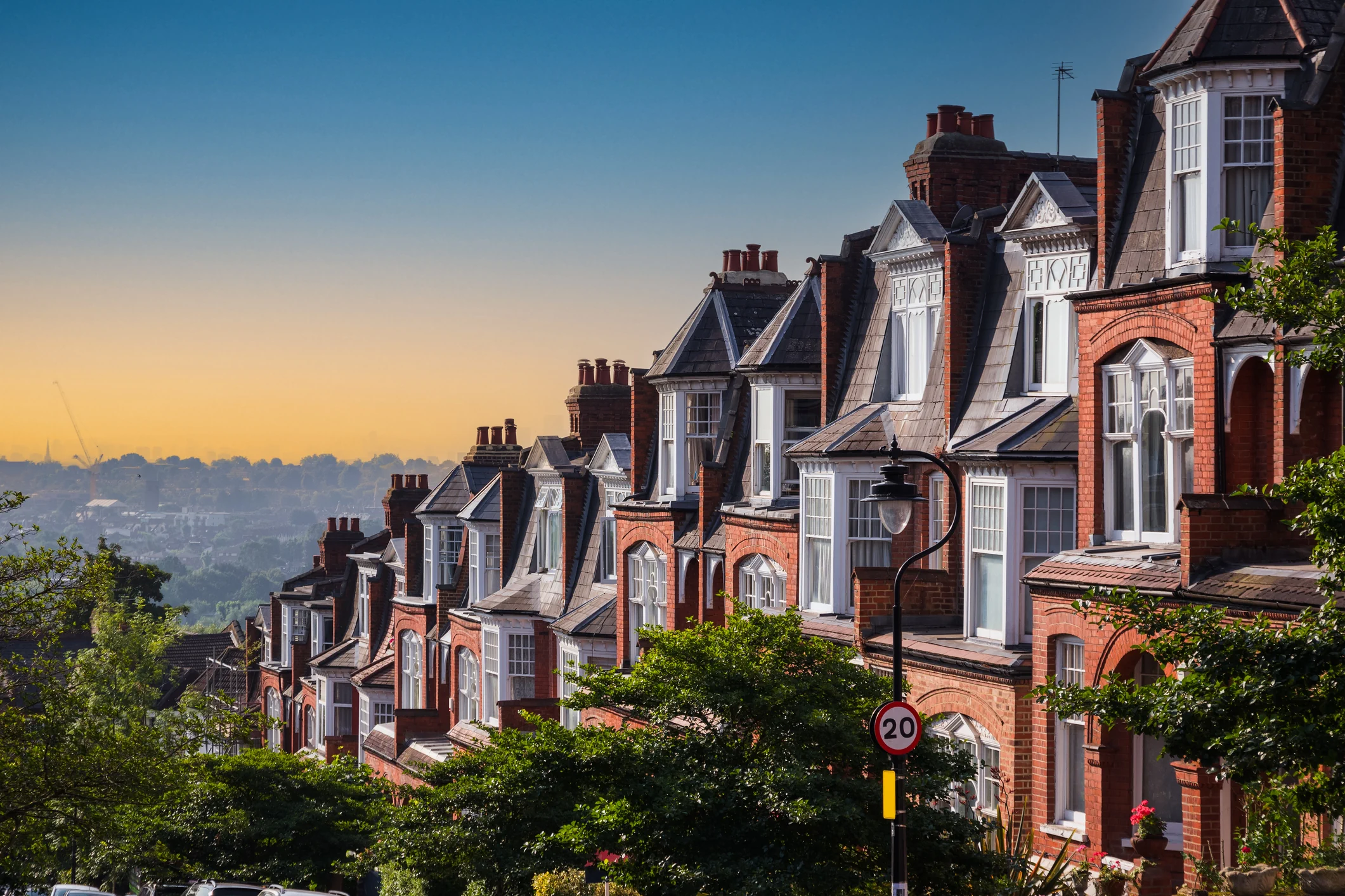 Row of traditional UK terraced houses representing buy to let property investment opportunities in residential neighbourhoods