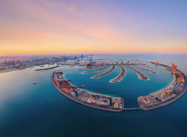 Aerial view of Palm Jumeirah in Dubai highlighting tax efficiency considerations and property investment opportunities