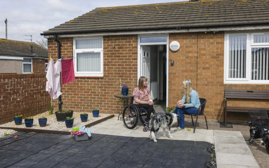 Accessible social housing property in the UK with wheelchair user comparing supported housing and buy to let options